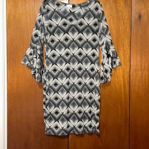 Olivia Matthew’s mid length dress.  3/4 flared sleeve